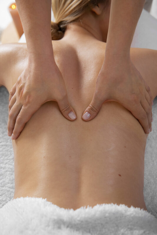 woman-getting-back-massage-from-masseur (2)